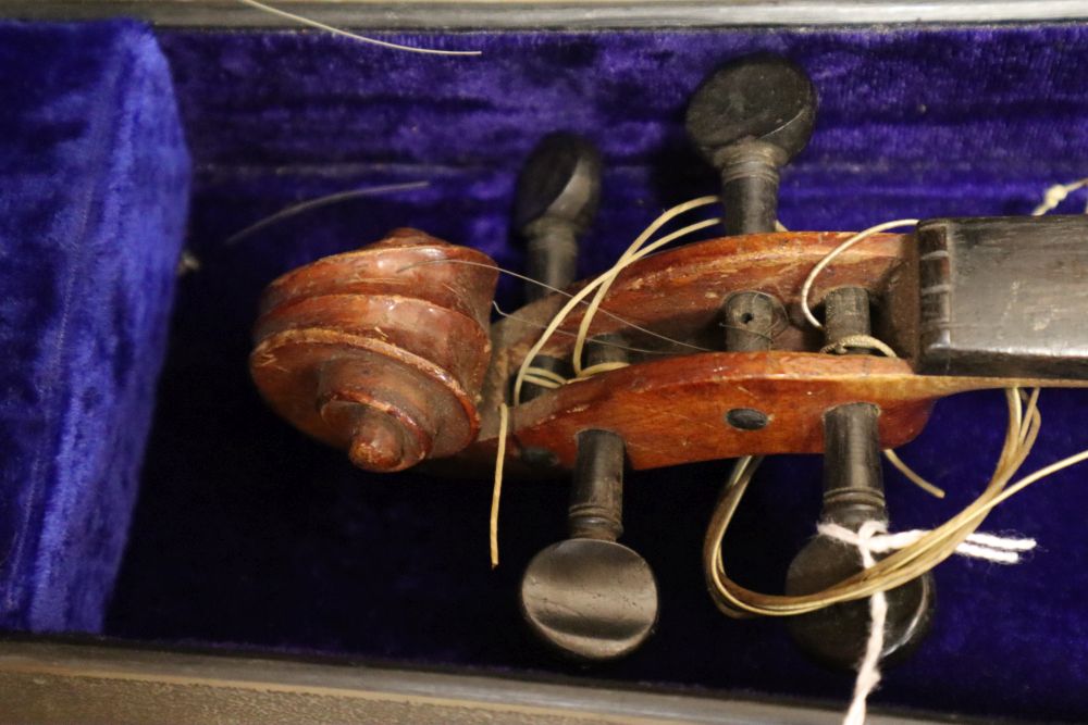 A Czech 3/4 size violin and a German 3/4 size violin, length of backs both 34cm